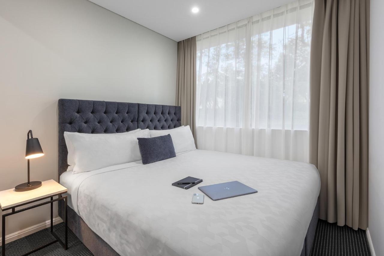 Meriton Suites North Ryde Cité de Cité de Sydney Extérieur photo A bedroom at the hotel