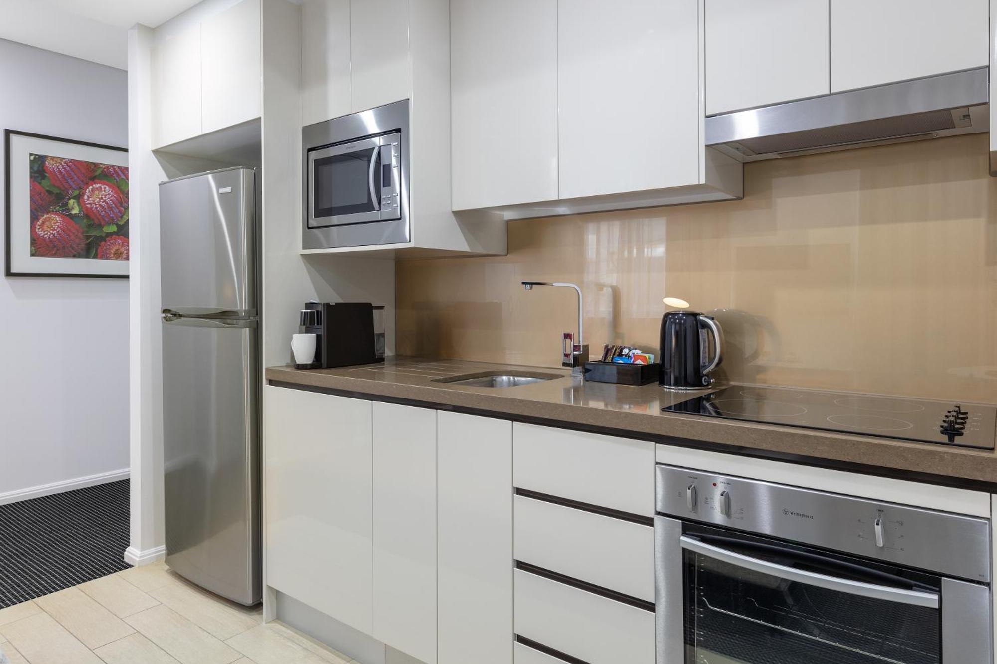 Meriton Suites North Ryde Cité de Cité de Sydney Extérieur photo A typical kitchen in a serviced apartment