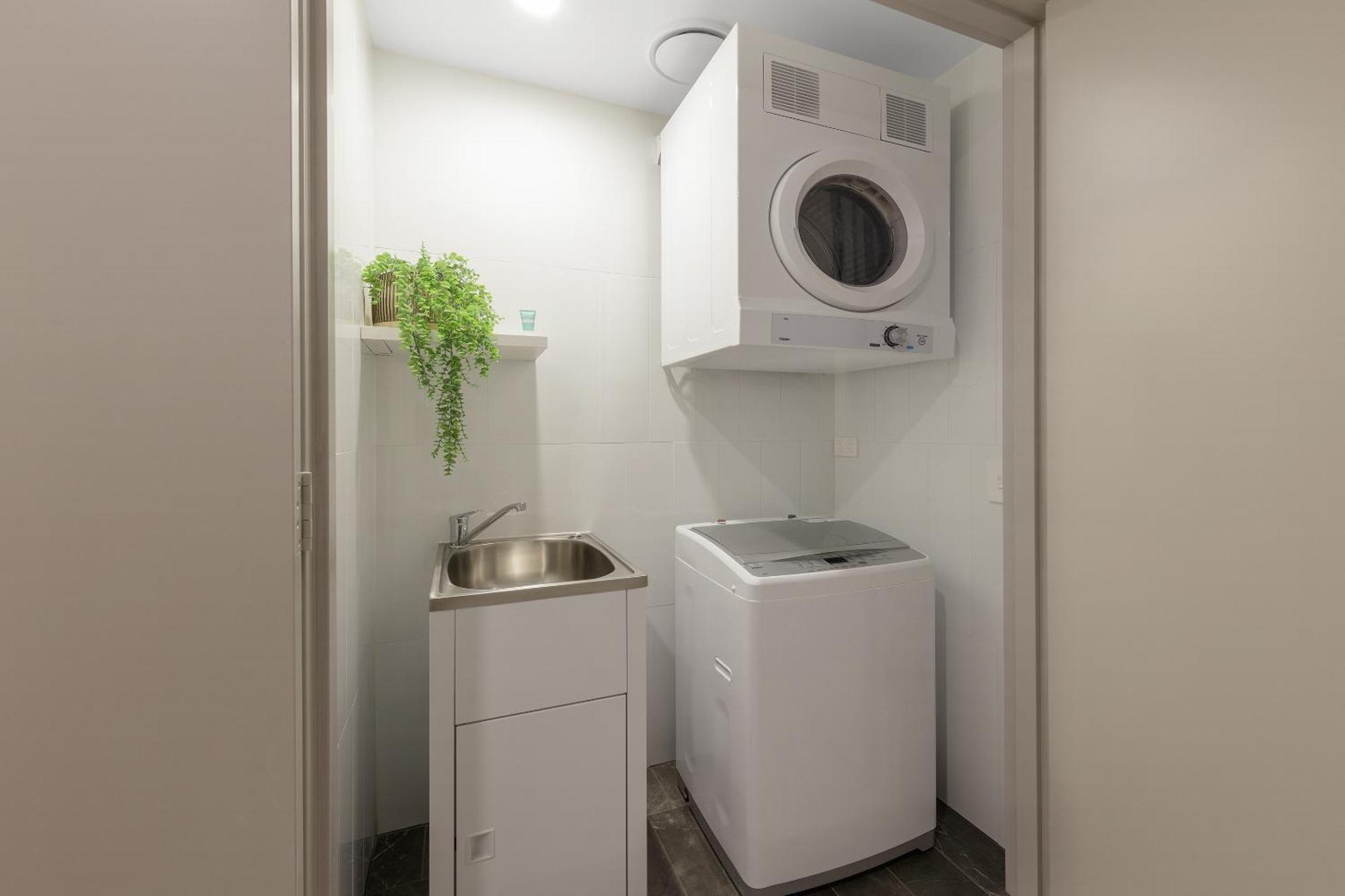 Meriton Suites North Ryde Cité de Cité de Sydney Extérieur photo Laundry room